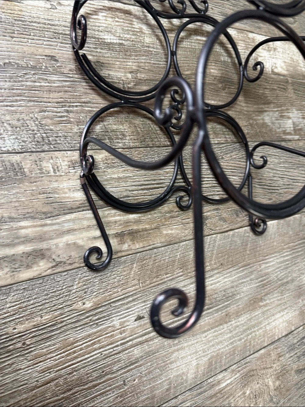 Decorative Black Metal Wall Wine Shelf - 4-Bottle Scroll Design